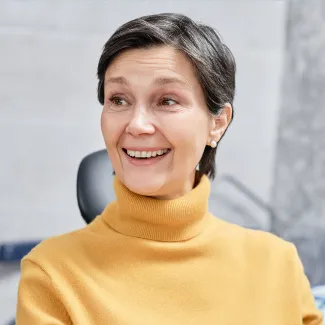 Older patient smiling after dental procedure